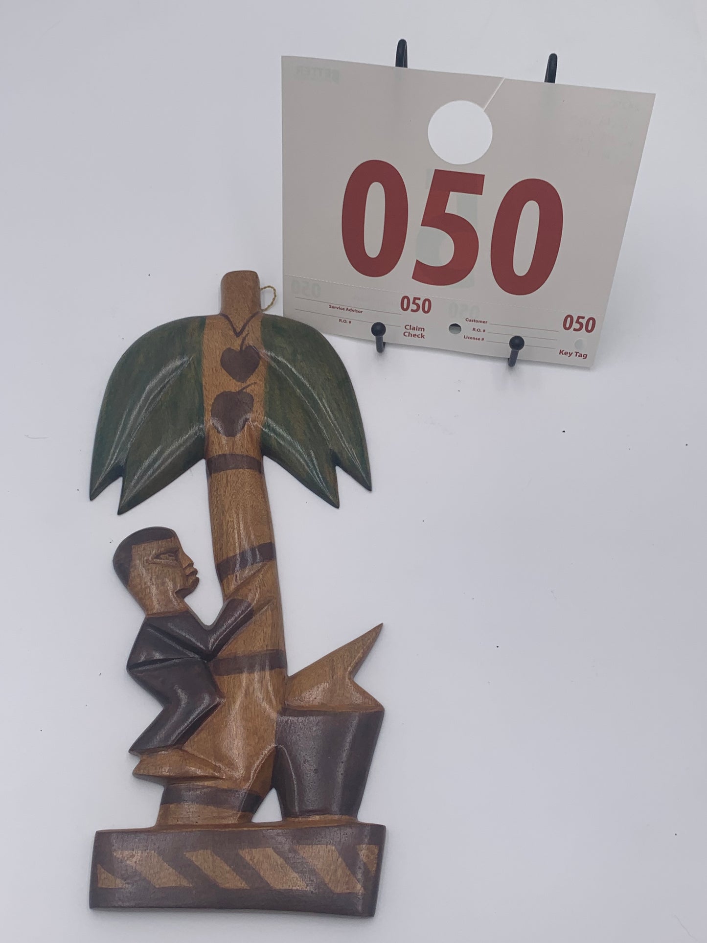 050 - Wooden Wall Plaque of Man Climbing Coconut Tree